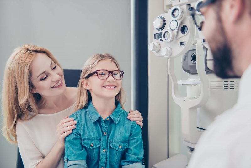 A young girl getting an eye exam